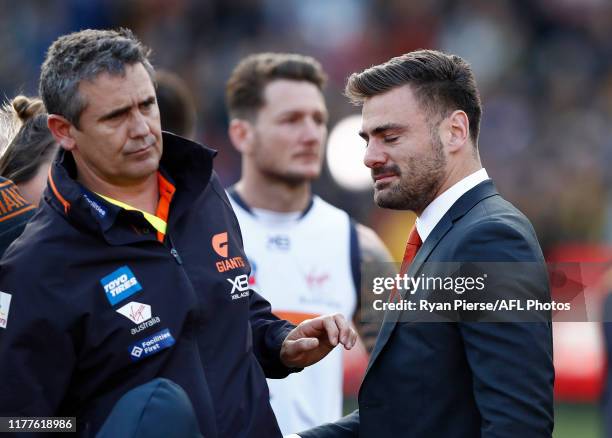 Leon Cameron, coach of the Giants and Stephen Coniglio of the Giants looks dejected after the 2019 AFL Grand Final match between the Richmond Tigers...