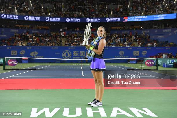Aryna Sabalenka of Belarus poses with her trophy after defeating Alison Riske of the United States during 2019 Wuhan Open singles final match at...