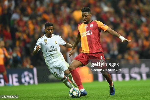 Galatasaray's Dutch midfielder Ryan Donk vies for the ball with Real Madrid's Brazilian forward Rodrygo during the UEFA Champions League group A...