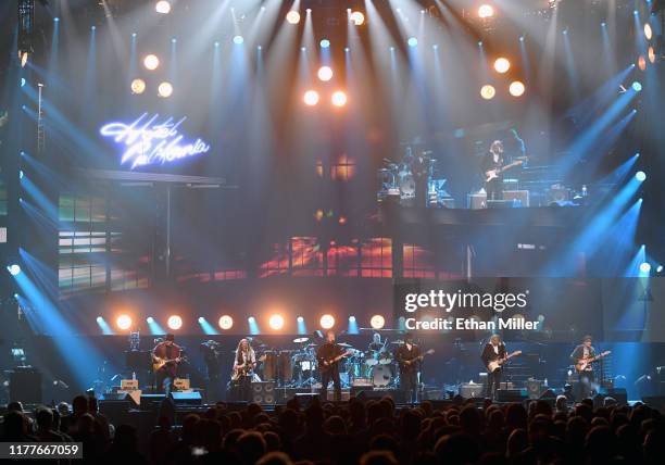 Vince Gill, Timothy B. Schmit, Don Henley, Scott F. Crago, Deacon Frey, Joe Walsh and Steuart Smith of the Eagles perform at MGM Grand Garden Arena...