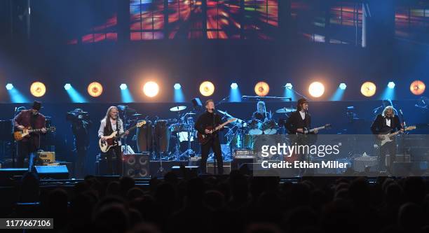 Vince Gill, Timothy B. Schmit, Don Henley, Scott F. Crago, Deacon Frey and Joe Walsh of the Eagles perform at MGM Grand Garden Arena on September 27,...