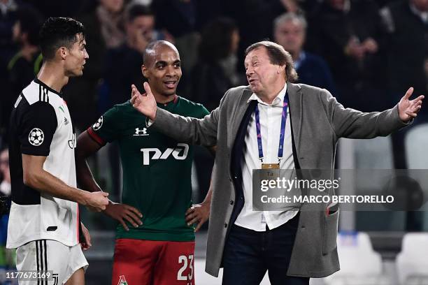 Juventus' Portuguese forward Cristiano Ronaldo, Lokomotiv Moscow's Portuguese midfielder Joao Mario and Lokomotiv Moscow's Russian coach Yuri Semin...