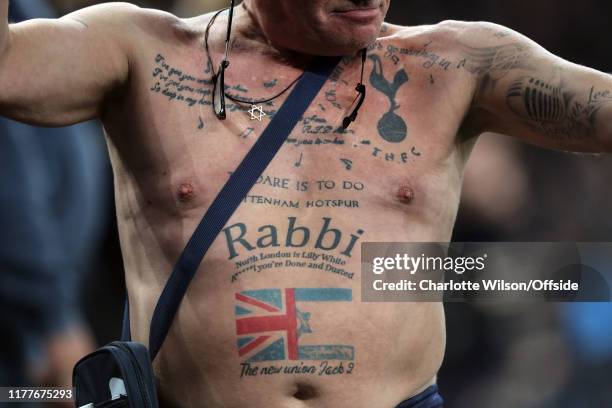 Can you identify the footballer from their tattoo?
