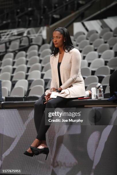 Swin Cash, Vice President of player operations for the New Orleans Pelicans, looks on before a pre-season game against the San Antonio Spurs on...