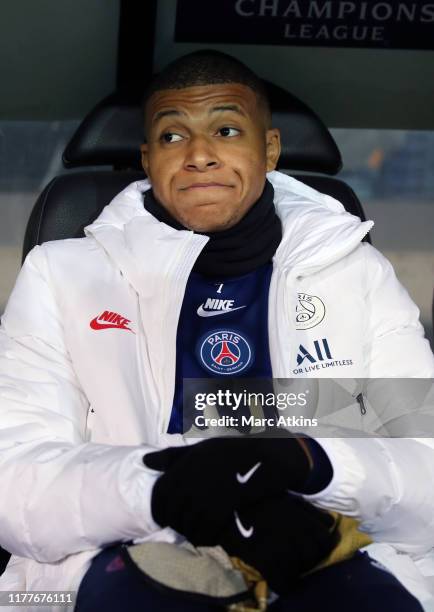 Kylian Mbappe of Paris Saint-Germain looks on from the substitutes bench during the UEFA Champions League group A match between Club Brugge KV and...