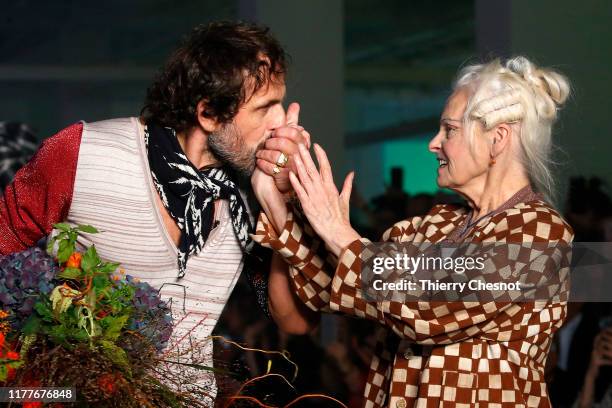 Designer Andreas Kronthaler embraces the hands of British designer Vivienne Westwood at the end of the Vivienne Westwood Womenswear Spring/Summer...