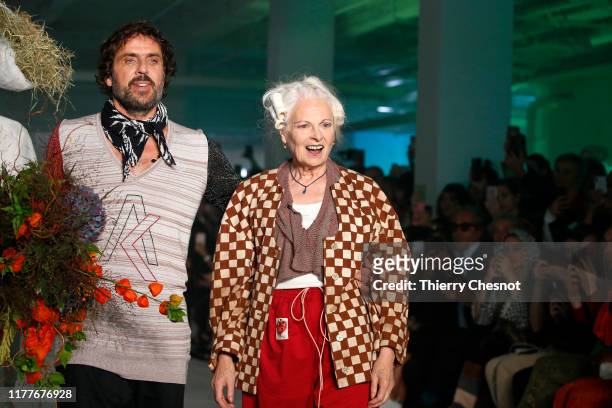 Designer Andreas Kronthaler and British designer Vivienne Westwood acknowledge the audience at the end of the Vivienne Westwood Womenswear...