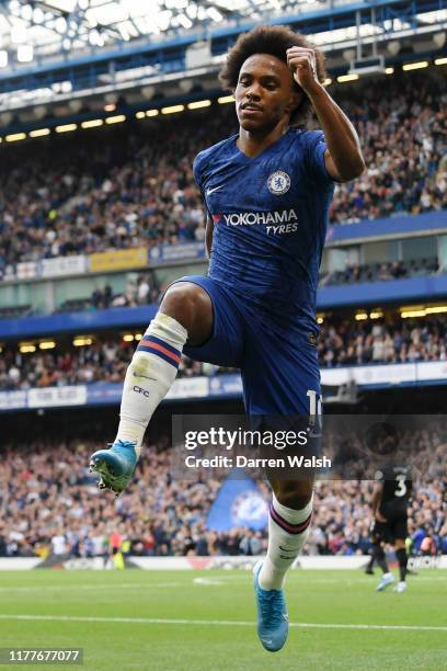 Willian of Chelsea celebrates after scoring his team's second goal during the Premier League match between Chelsea FC and Brighton & Hove Albion at...