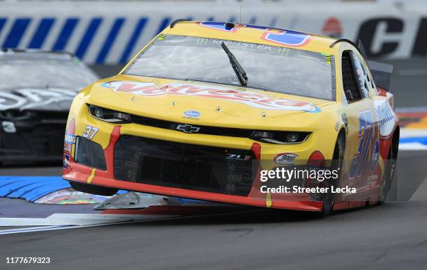 Chris Buescher, driver of the Velveeta Chevrolet, during practice for the Monster Energy NASCAR Cup Series Bank of America ROVAL 400 at Charlotte...