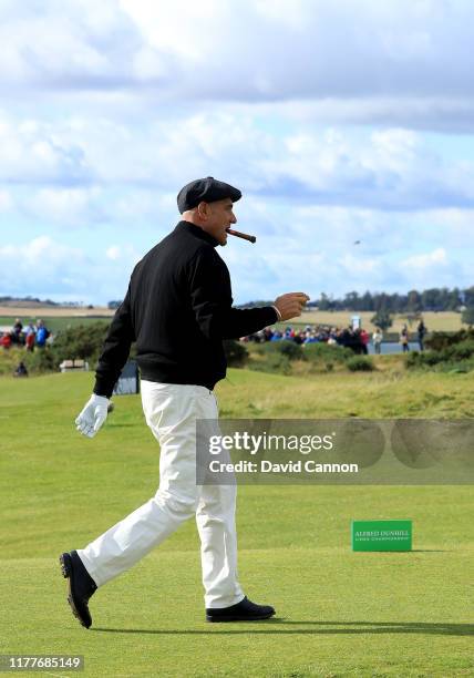 Vinnie Jones of England the former soccer star and Hollywood actor plays a shot during the third round of the Alfred Dunhill Links Championship on...