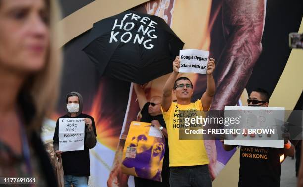 Anti-Chinese Communist Party activists protest outside Staples Center where free t-shirts were distributed supporting Hong Kong ahead of the Lakers...
