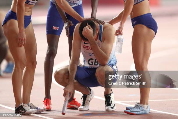 Rabah Yousif, Zoey Clark, Emily Diamond and Martyn Rooney of Great Britain react after competing in the 4x400 Metres Relay Mixed heats in during day...