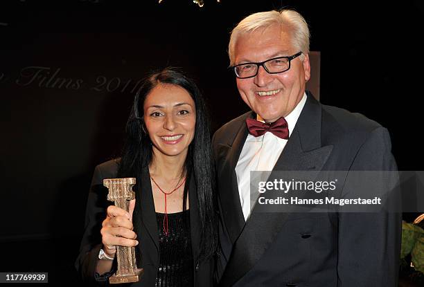 Yasemin Samdereliand Frank-Walter Steinmeier attend the Bernhard Wicki Award 'Die Bruecke - Der Friedenspreis des Deutschen Films 2011' at the...