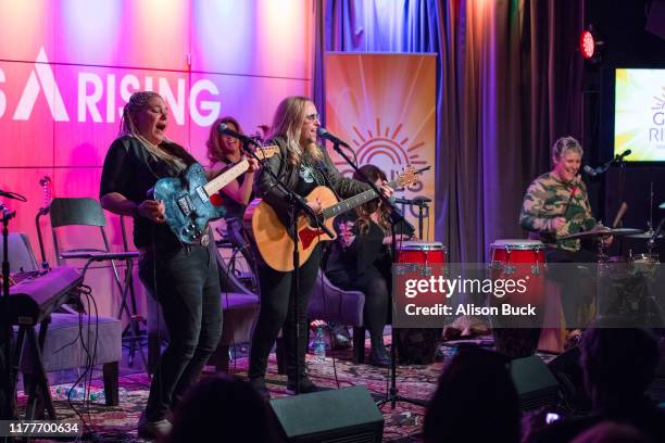 Cathy Henderson, Melissa Etheridge, Nini Camps, Carnie Wilson and Kristen Henderson perform onstage during Girls Rising Panel & Performance at GRAMMY...