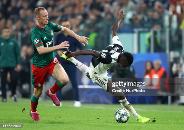 Vladislav Ignatyev of Lokomotiv Moskva and Blaise Matuidi of Juventus during the UEFA Champions League Group stage match FC Juventusv v FC Lokomotiv...