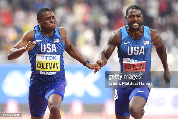 Christian Coleman of the United States crosses the finish line next to Justin Gatlin of the United States to win the Men's 100 Metres final final...