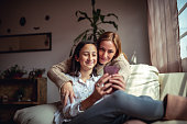 Mother and daughter using a smartphone