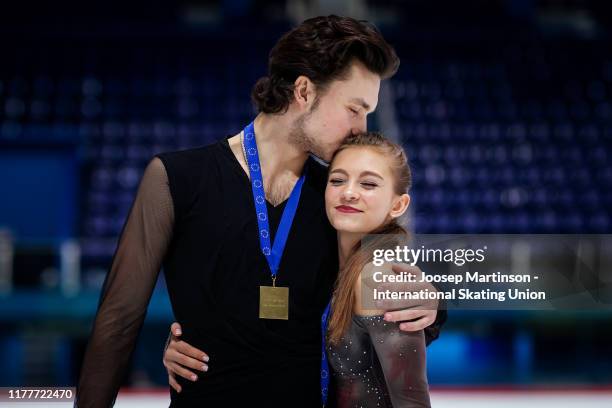 Maria Kazakova and Georgy Reviya of Georgia pose for a photo in the Junior Ice Dance Medal ceremony during the ISU Junior Grand Prix of Figure...