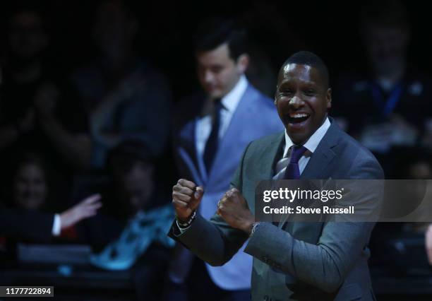 Raptors President Masai Ujiri celebrates on his way to receive his ring as the Toronto Raptors open the season against the New Orleans Pelicans with...