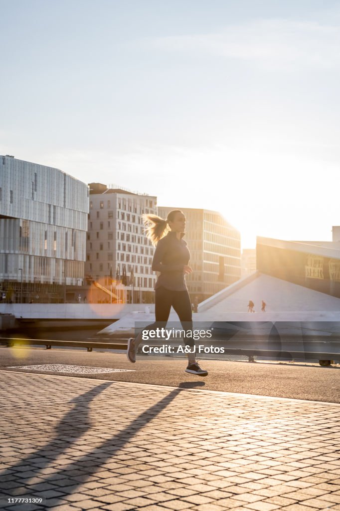 Woman exercising in early morning.