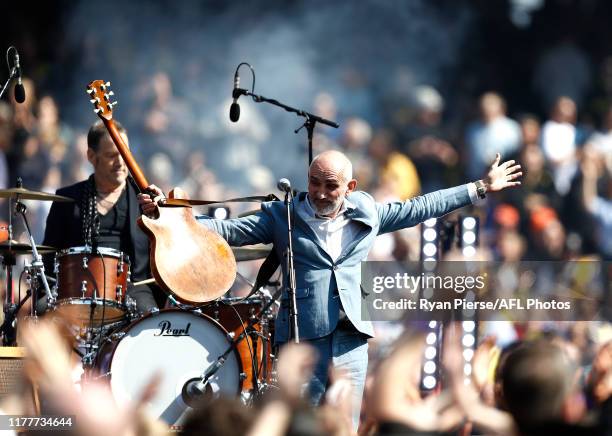 Paul Kelly performs before during the 2019 AFL Grand Final match between the Richmond Tigers and the Greater Western Sydney Giants at Melbourne...