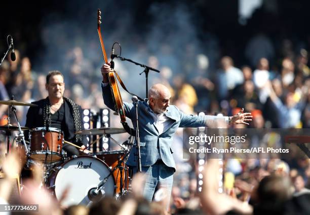 Paul Kelly performs before during the 2019 AFL Grand Final match between the Richmond Tigers and the Greater Western Sydney Giants at Melbourne...