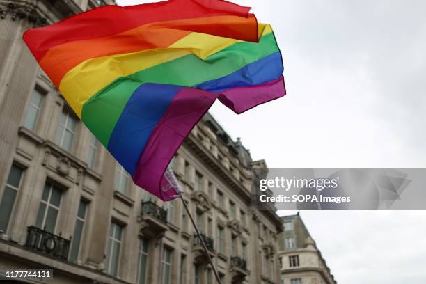 Pride Flag flying during the parade. The 50th Pride Parade toke place through Central London with over one million participants.