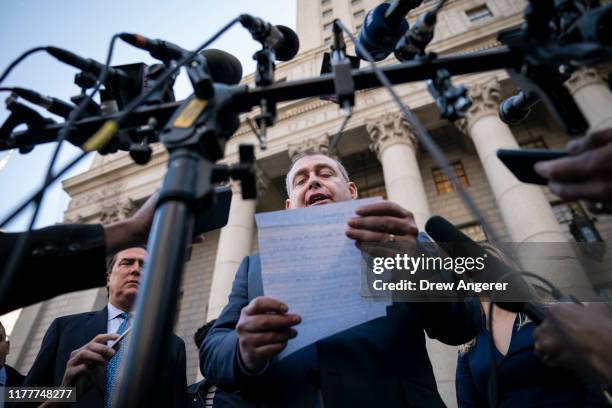 Lev Parnas reads a brief statement to the press as he exits federal court following an arraignment hearing on October 23, 2019 in New York City. Lev...