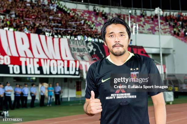 Shinzo Koroki of Urawa Red Diamonds poses for photo after winning the AFC Champions League Semi Final second leg match between Guangzhou Evergrande...