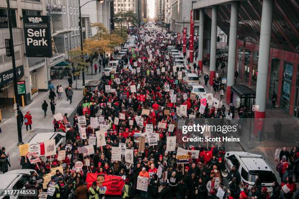 Thousands of demonstrators take to the streets, stopping traffic and circling City Hall in a show support for the ongoing teachers strike on October...