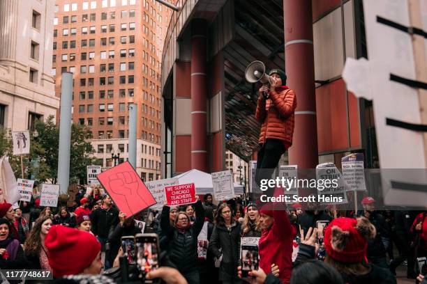 Thousands of demonstrators take to the streets, stopping traffic and circling City Hall in a show support for the ongoing teachers strike on October...