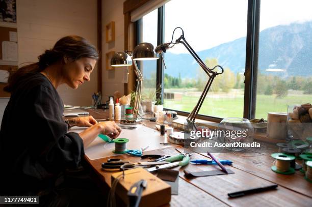 female entrepeneur working from home - jewelry maker stock pictures, royalty-free photos & images