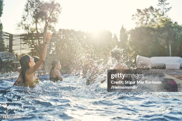 cheerful friends enjoying in swimming pool - pool party stock pictures, royalty-free photos & images