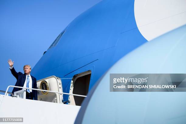 President Donald Trump boards Air Force One at Joint Base Andrews in Maryland on October 23 as he travels to Pittsburgh, Pennsylvania.