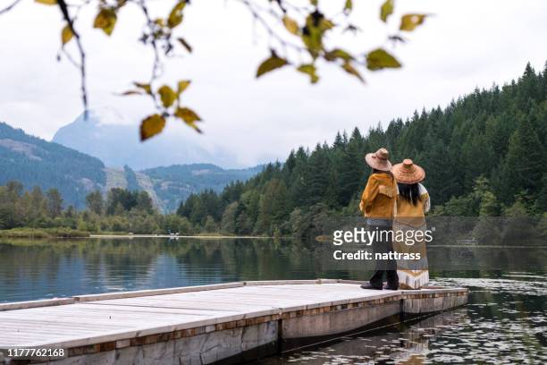 two female first nations dressed in traditional clothing singing - british columbia stock pictures, royalty-free photos & images