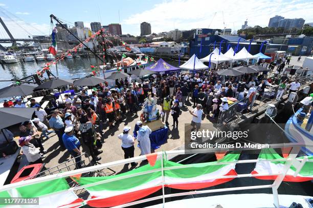 Local fishermen about to have their boats blessed by a priest during the blessing of the fleet celebrations at Sydney Fish Market on September 29,...