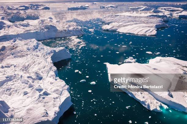 aerial view of icebergs in greenland - north stock pictures, royalty-free photos & images
