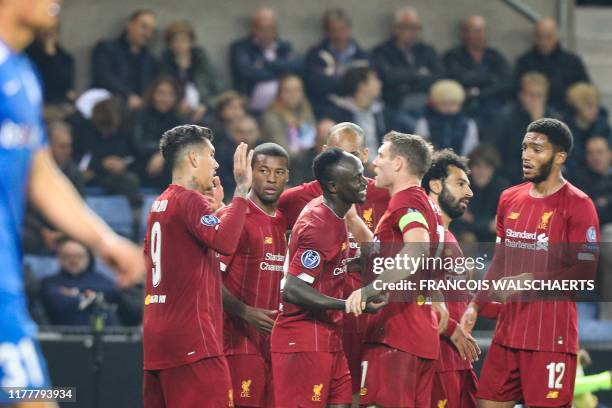 Liverpool's Senegalese striker Sadio Mane celebrates with teammates after scoring a goal during the UEFA Champions League Group E football match...