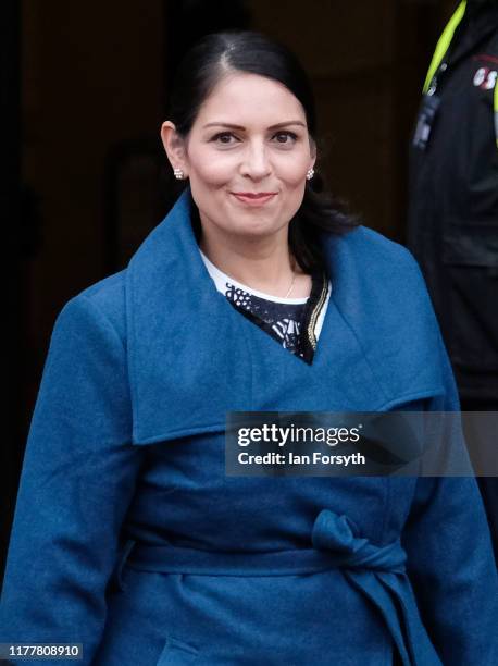 Priti Patel, Secretary of State for the Home Department leaves the Midland Hotel for a media appearance on the first day of the Conservative Party...