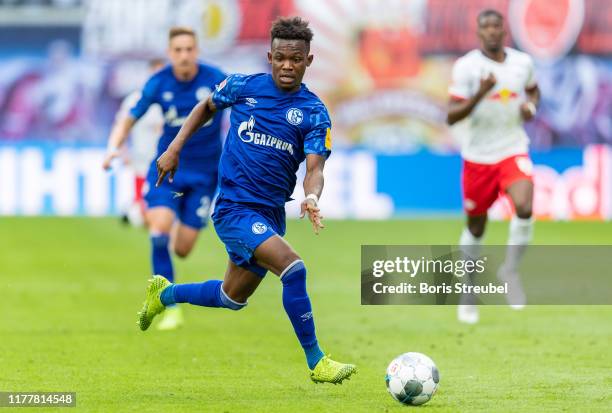 Rabbi Matondo Baba of VfL Wolfsburg runs with the ball during the Bundesliga match between RB Leipzig and FC Schalke 04 at Red Bull Arena on...