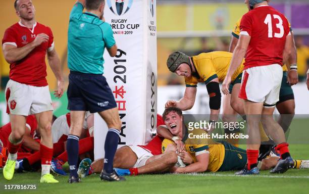 Michael Hooper of Australia touches down to score his team's third try during the Rugby World Cup 2019 Group D game between Australia and Wales at...