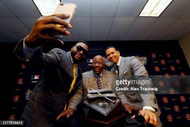 Hall of Famer Hank Aaron takes a selfie with former Major League players and FOX analysts David Ortiz and Alex Rodriguez during the Hank Aaron Press...