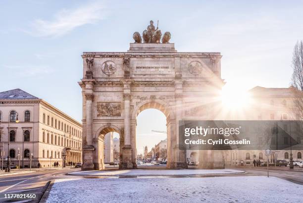 siegestor against clear sky - munich stock pictures, royalty-free photos & images