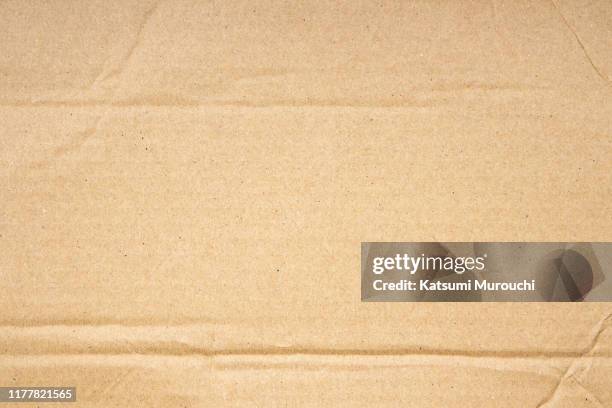 creased cardboard texture background - cardboard stock-fotos und bilder