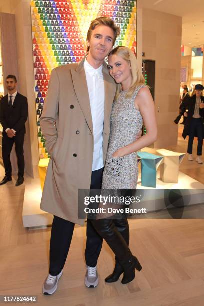 James Cook and Poppy Delevingne attend the re-opening of the Louis Vuitton New Bond Street Maison on October 23, 2019 in London, England.