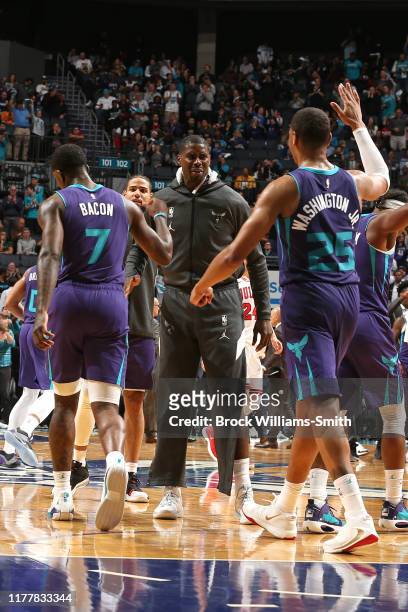 Marvin Williams of the Charlotte Hornets celebrates with teammates during the game against the Chicago Bulls on October 23, 2019 at Spectrum Center...