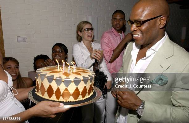 Erica Reid presents the birthday to Antonio "LA" Reid