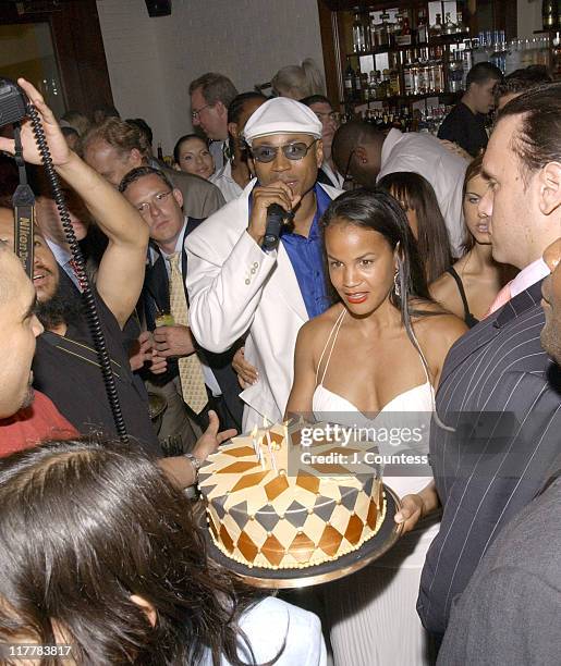 Cool J leads party goers in wishing Happy Birthday as Erica Reid presents the birthday to Antonio "LA" Reid