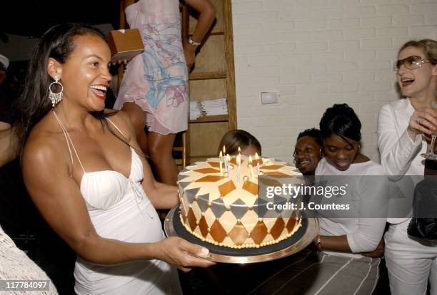 Erica Reid presents the birthday to Antonio "LA" Reid