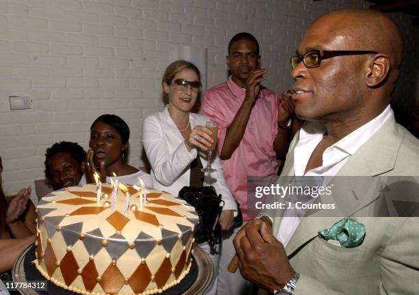 Erica Reid presents the birthday to Antonio "L.A." Reid
